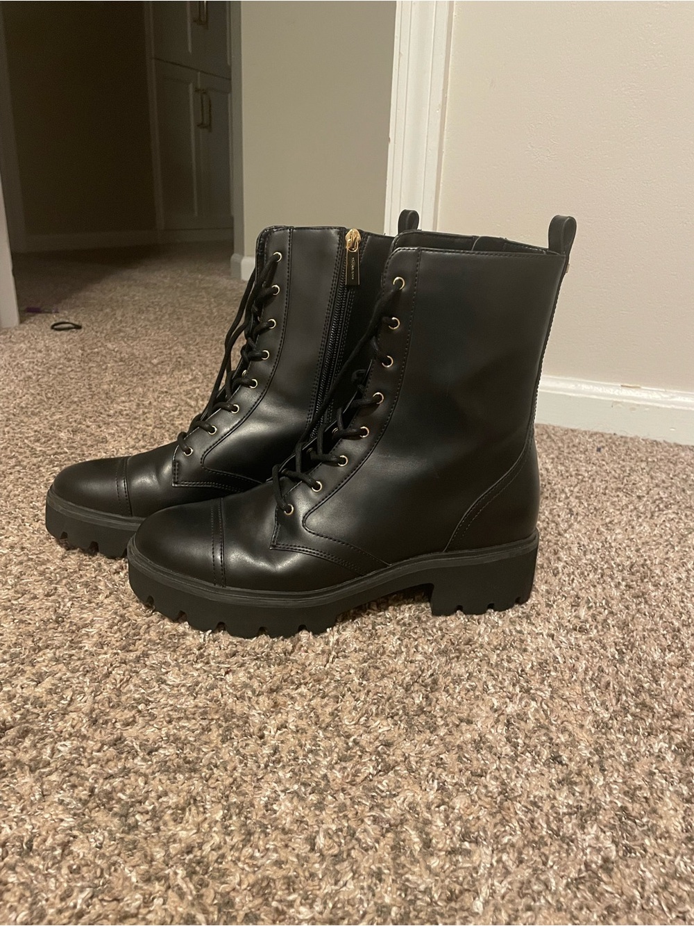 MICHAEL KORS black combat boots.